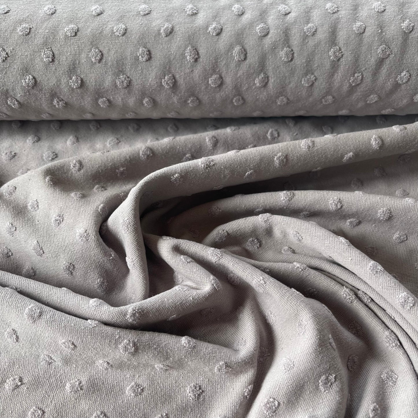 Jersey plumetis gris