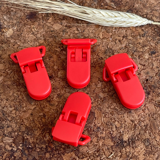 Pince attache tétine et bretelle rouge