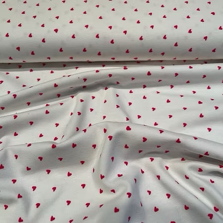 Jersey de coton fond blanc écru - cœurs rouges