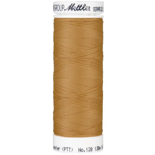 Fil à coudre élastique Seraflex Mettler 130 m -  1121 beige moyen